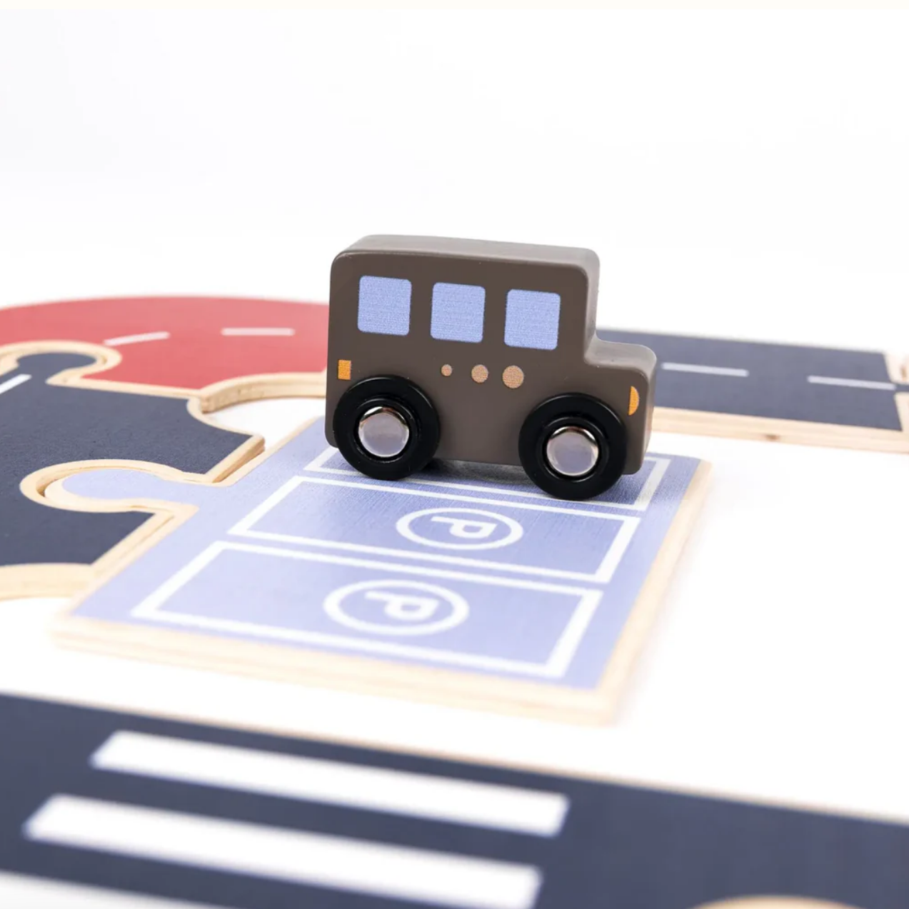 Toy bus on a puzzle road