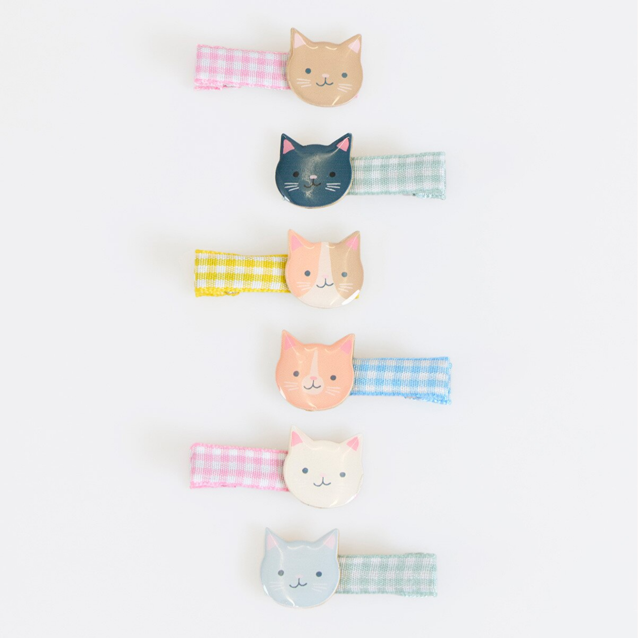 Set of cat-themed hairbands on a white background