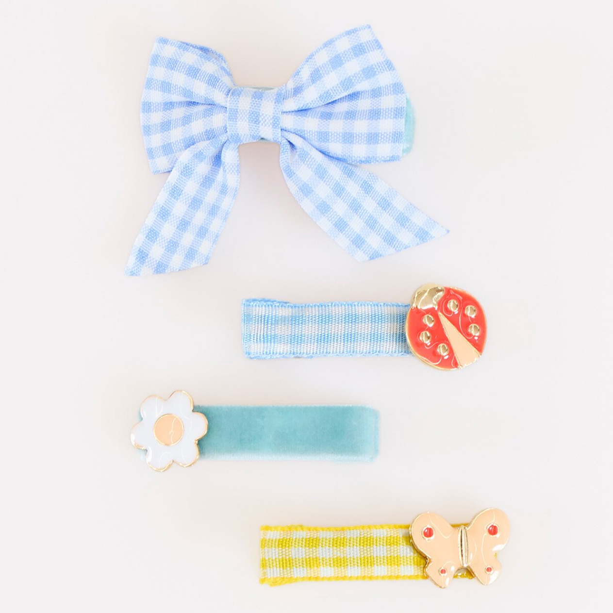 Set of blue and white checkered hair accessories on a light background