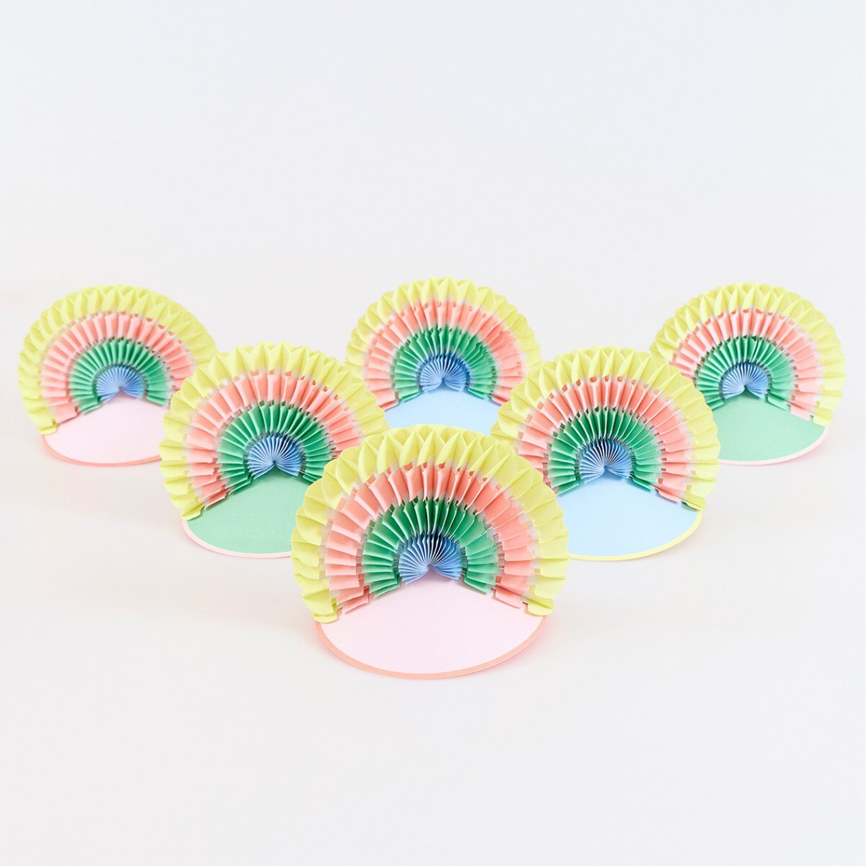 Set of colorful paper fan hats on a white background