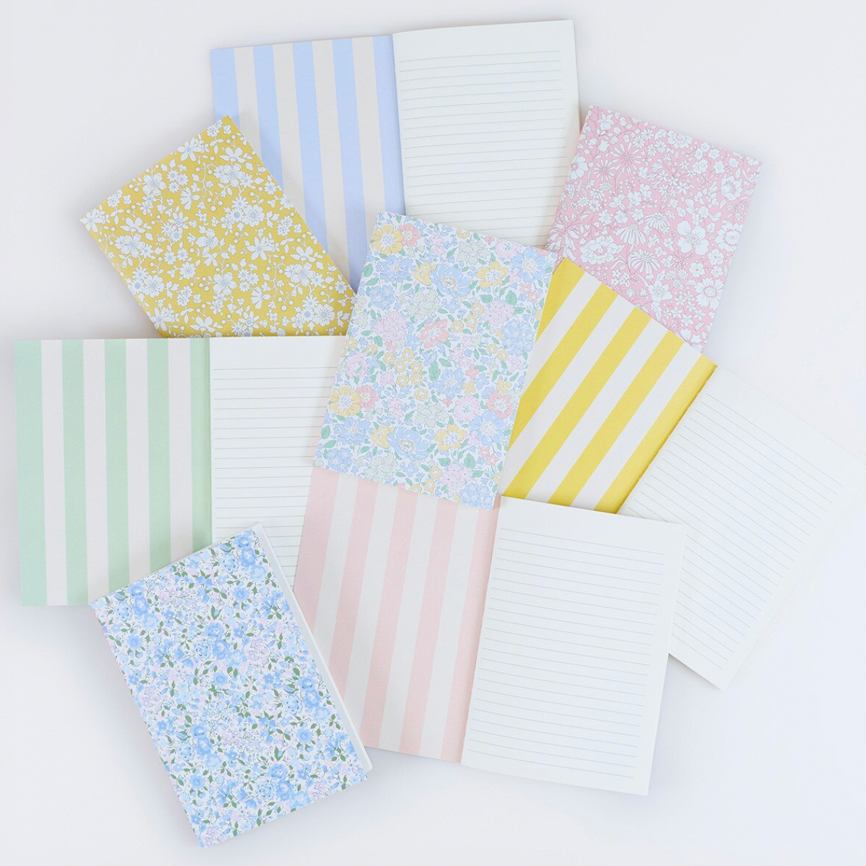 Collection of patterned paper sheets on a white background