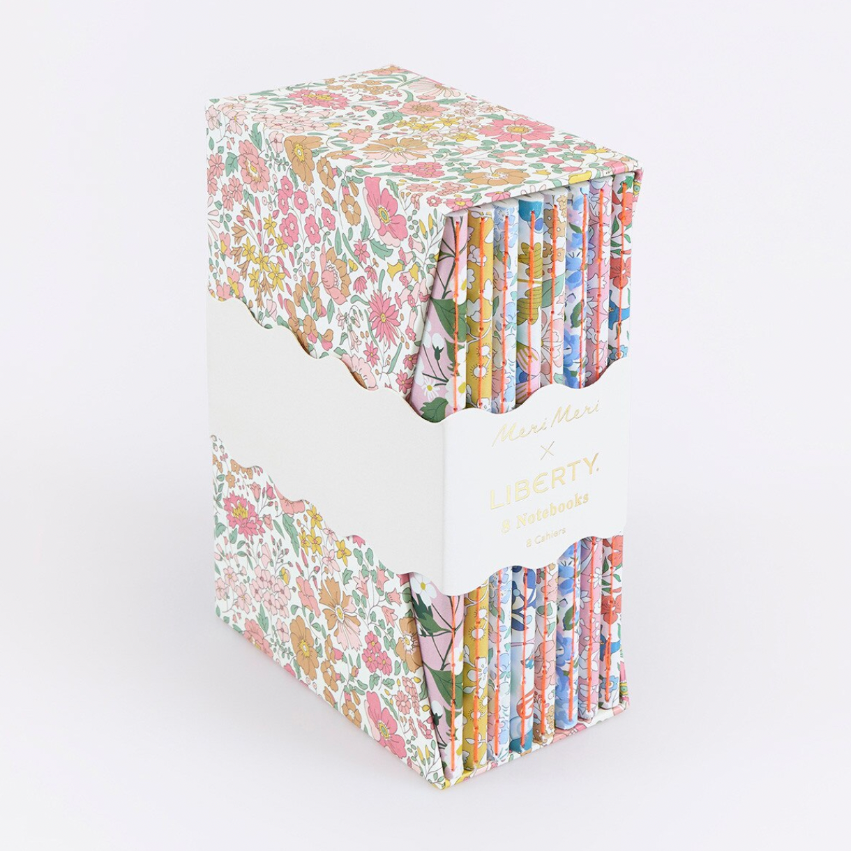Stack of colorful fabric squares in a box on a white background