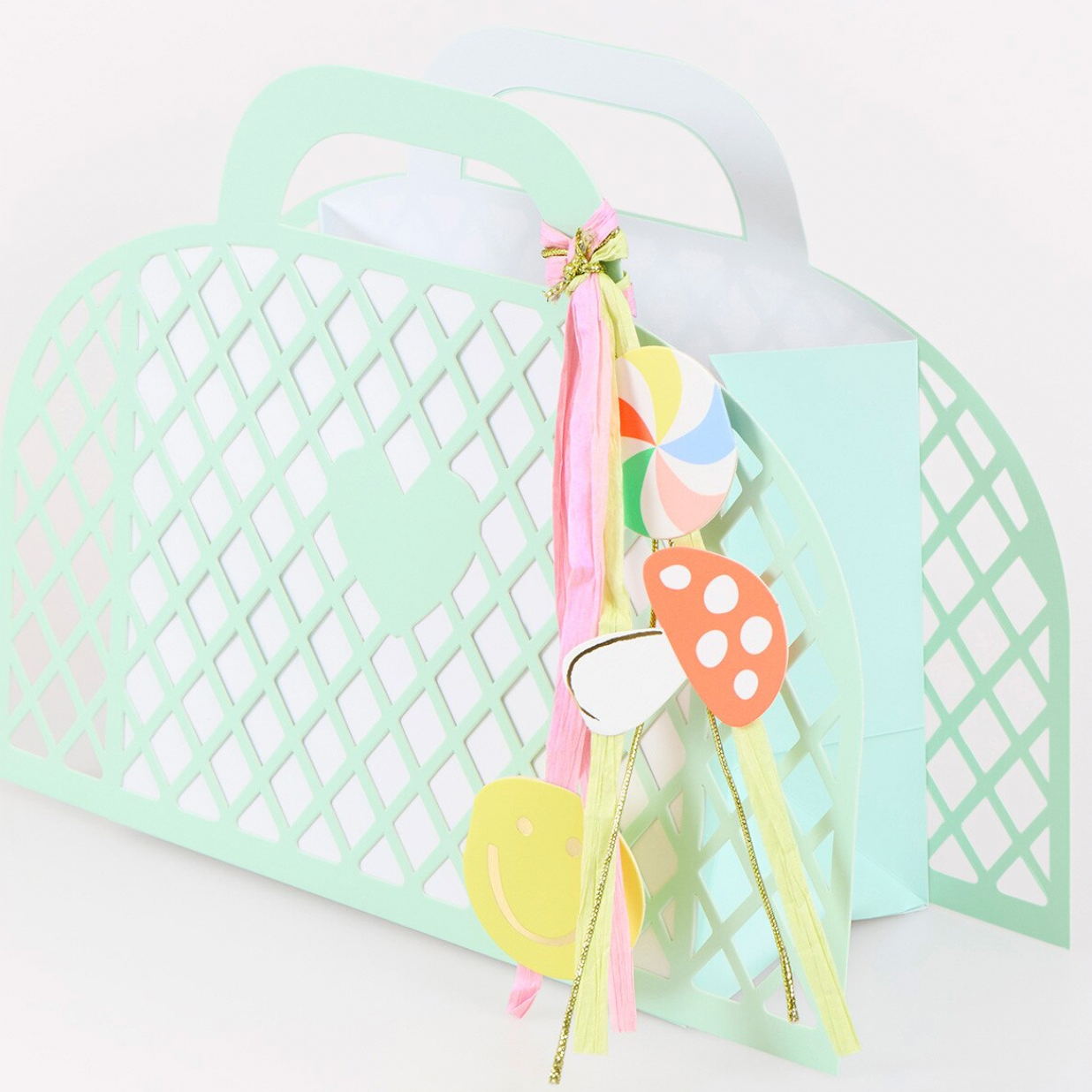 Pastel-colored hair accessories with a decorative bow on a white background