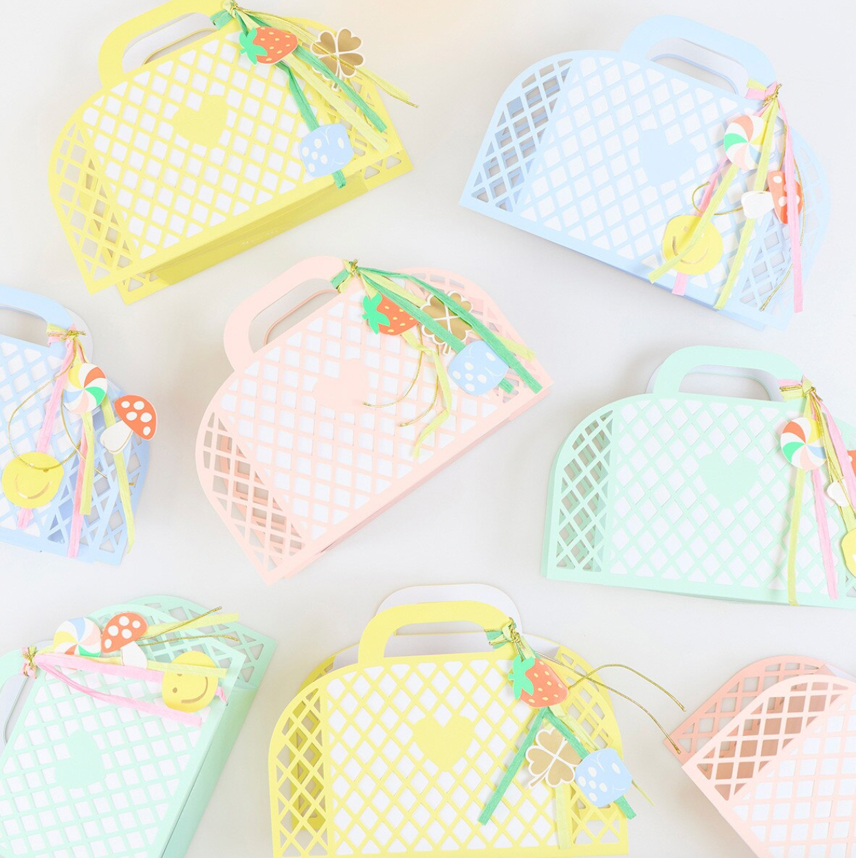 Set of colorful mesh bags with handles on a white background