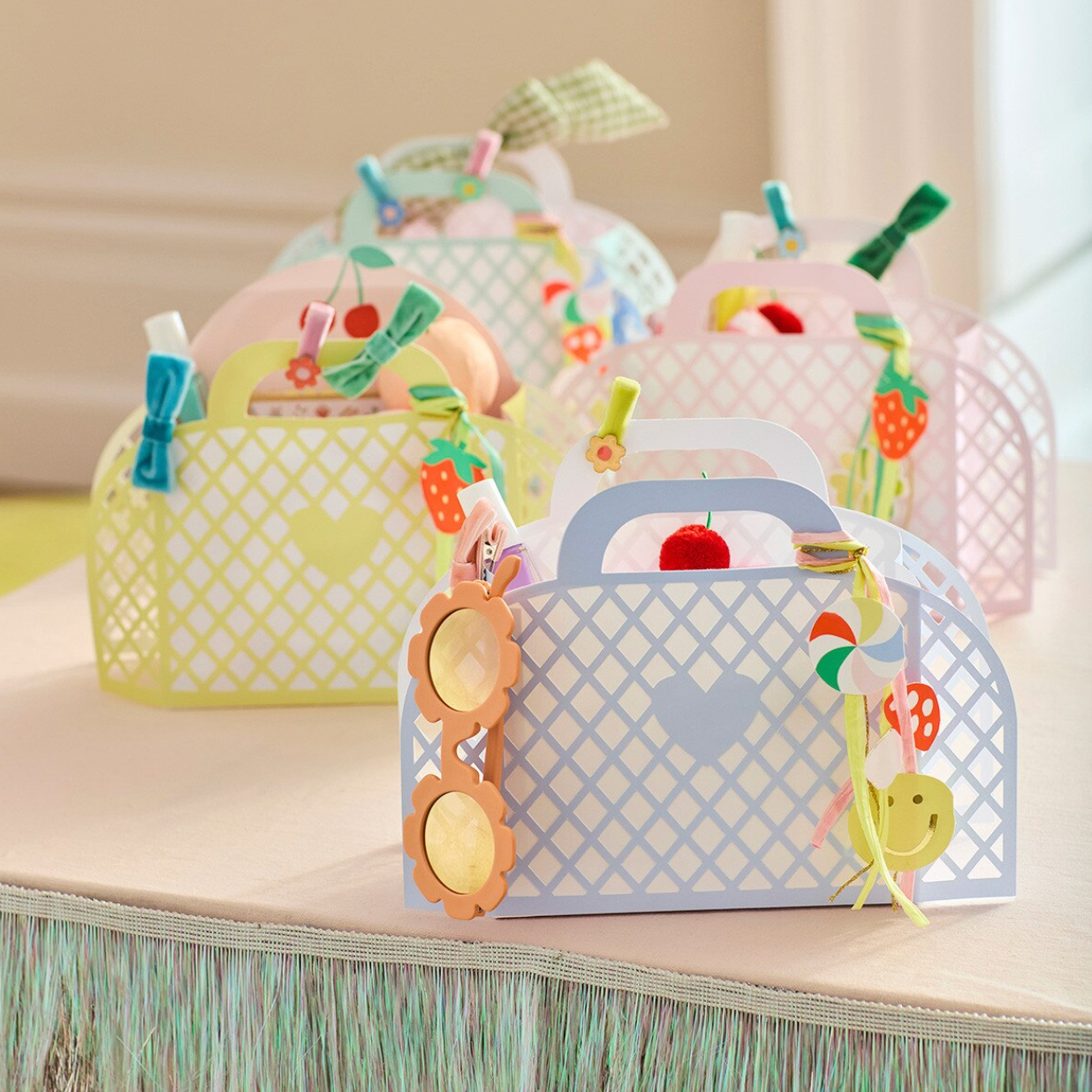 Decorative paper bags with colorful designs on a neutral background