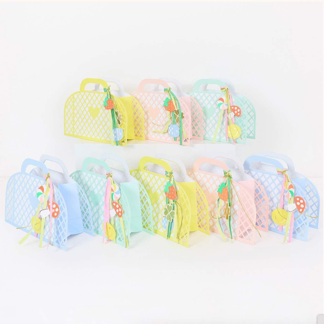Set of colorful party bags with cartoon characters on a white background