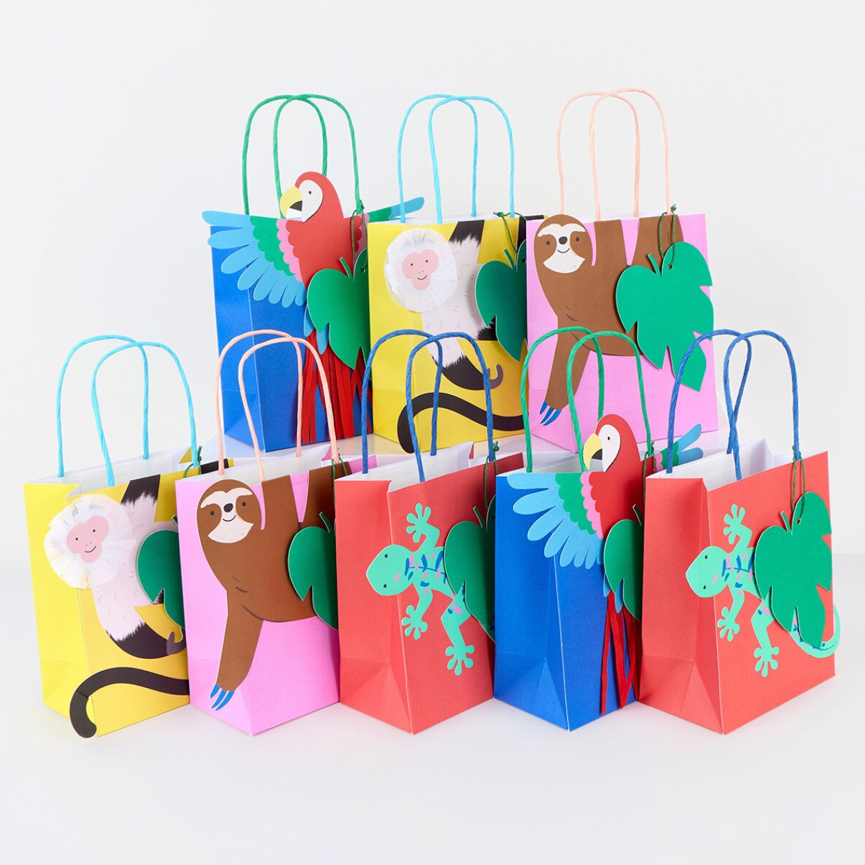 Colorful paper bags with animal designs on a white background