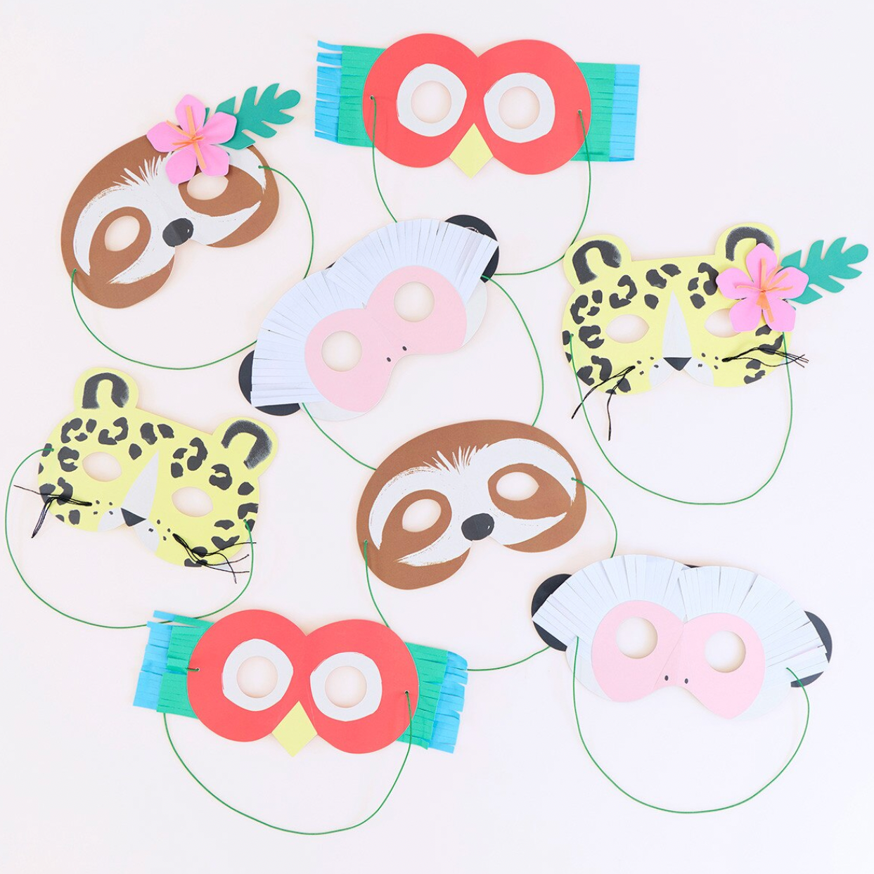 Set of animal-themed paper masks on a white background