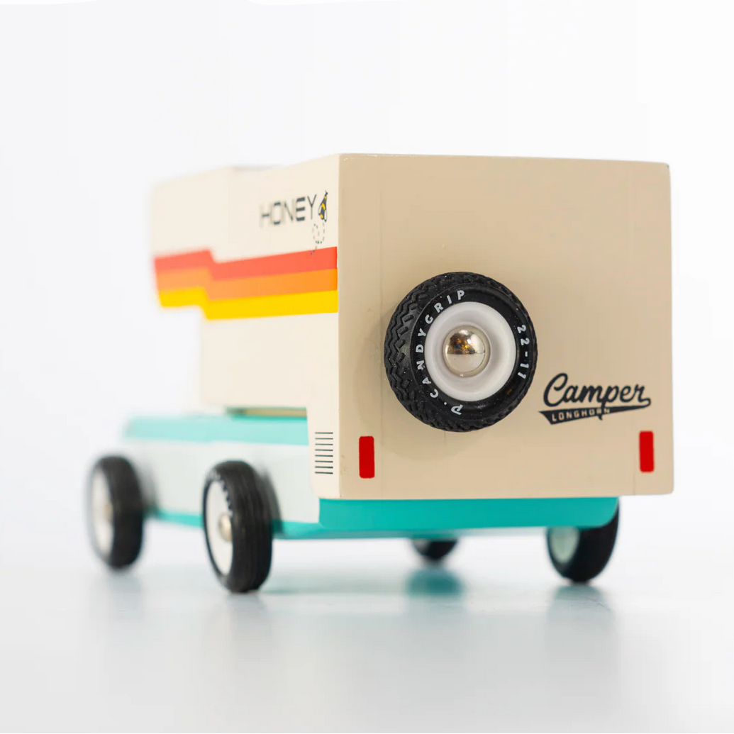Toy camper with colorful design on a white background.