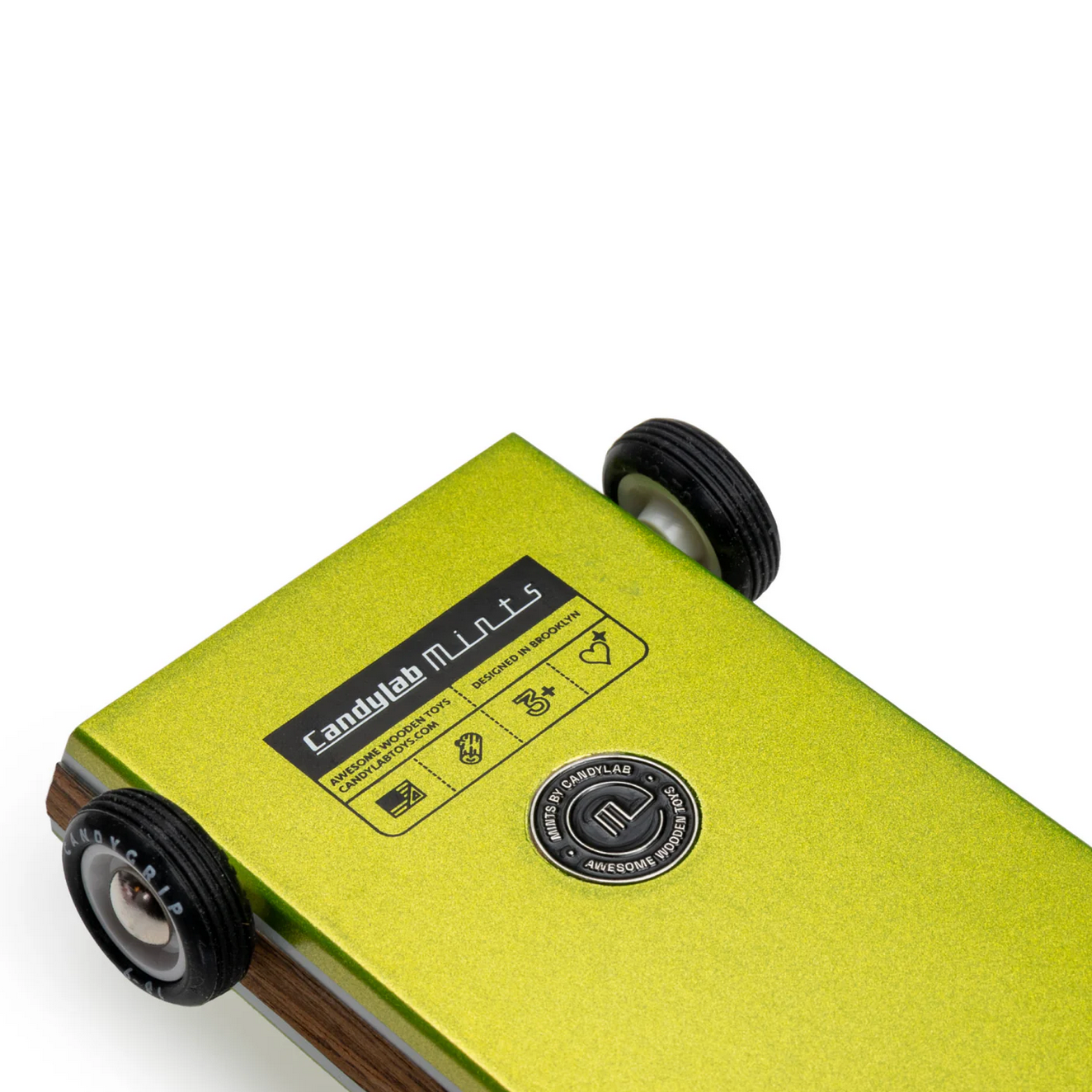 Green toy with wheels featuring the brand 'Candylab'.