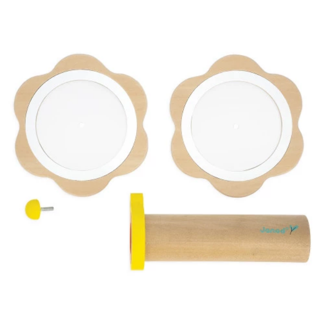 Two wooden circular objects with a white center and a cylindrical tool with a yellow tip on a white background.