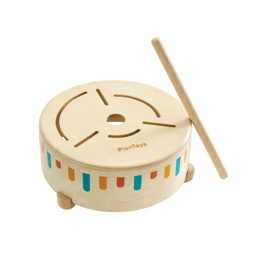 Wooden toy drum with colorful stripes and a drumstick on a white background, branded 'PlanToys'.