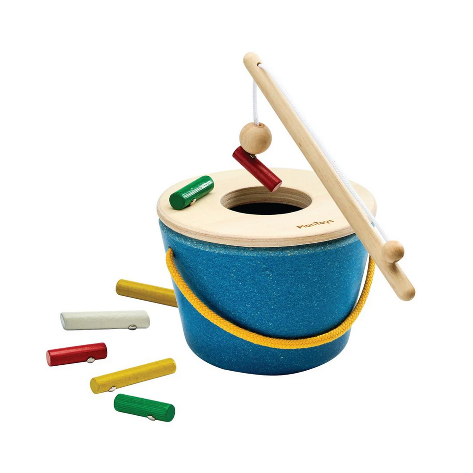 Children's wooden toy with blue bucket, colorful sticks, and a white background