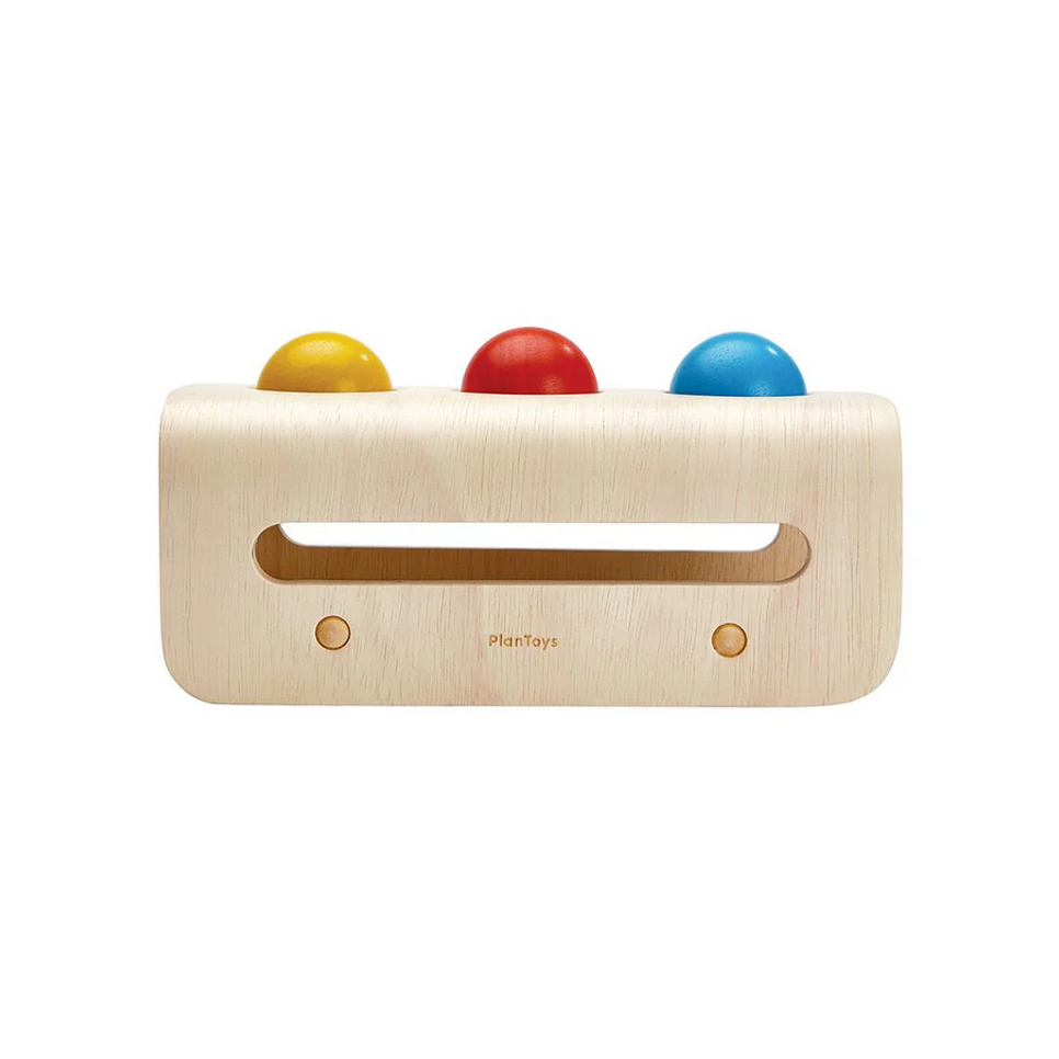 Wooden toy with colorful balls on a white background