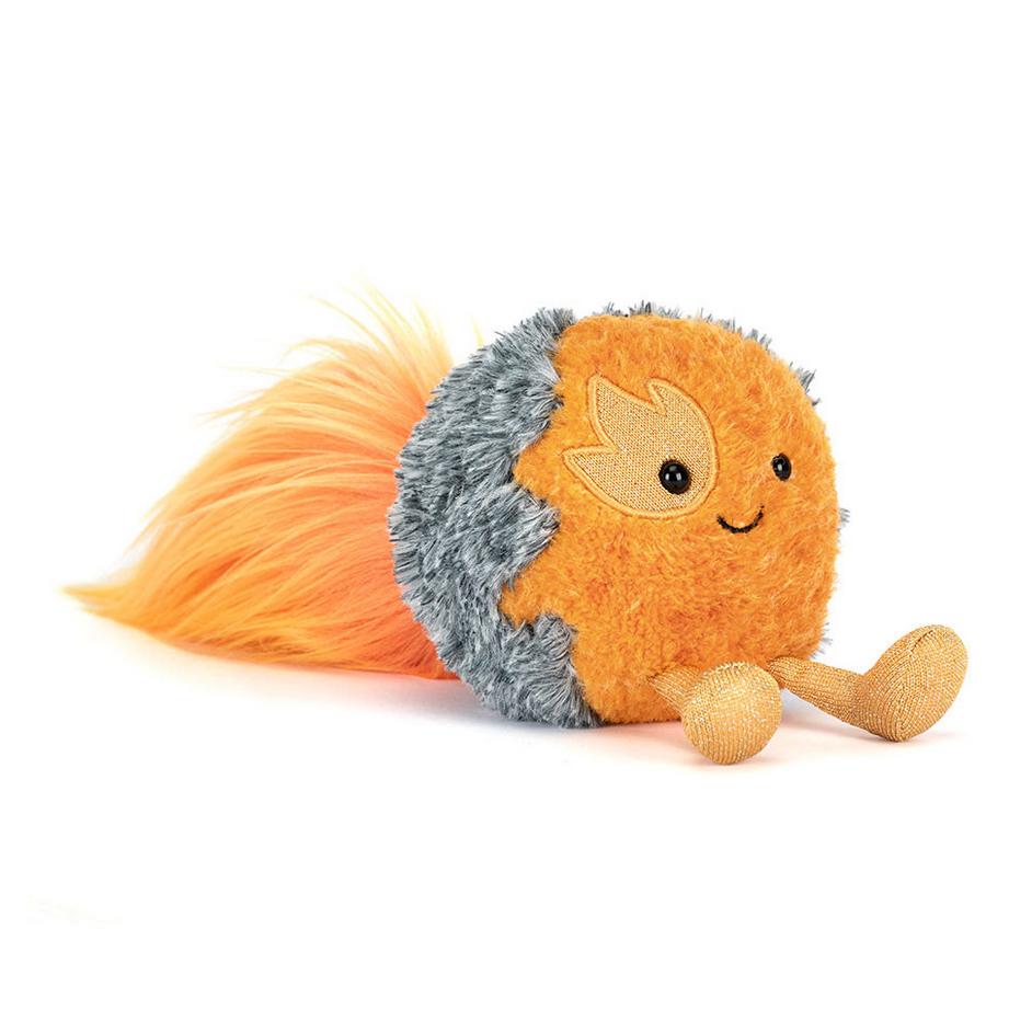 Plush toy resembling a space comet on a white background