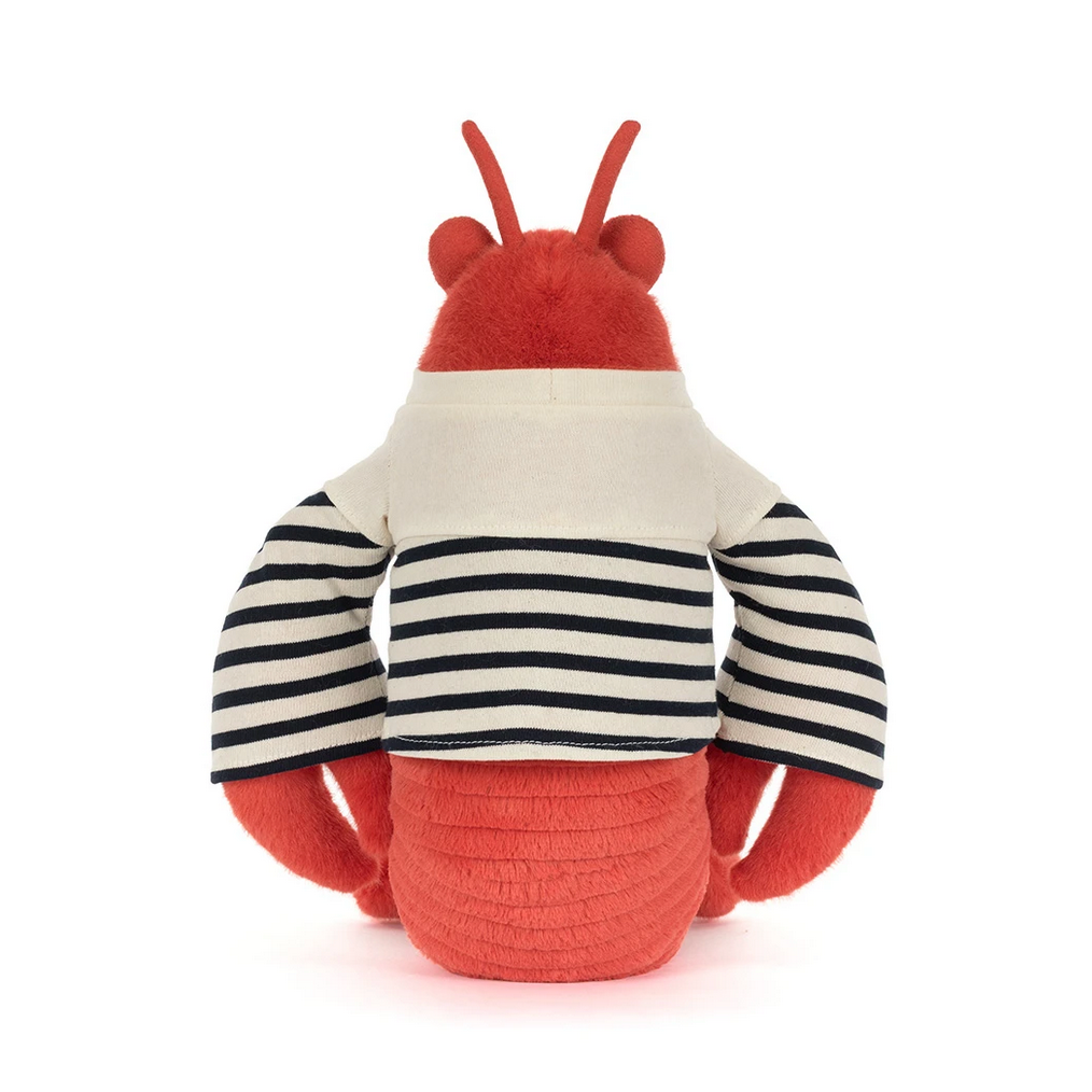 Toy lobster with red and white striped shirt on a white background