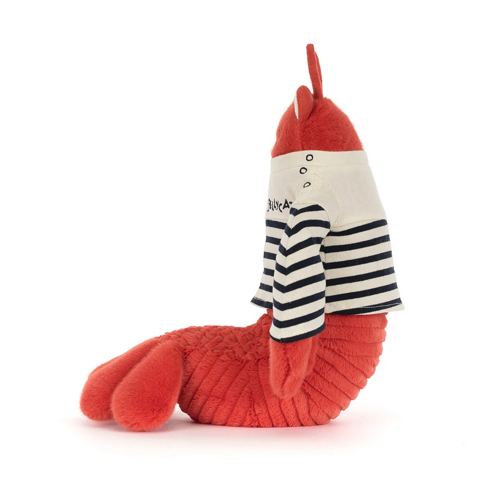 Plush toy lobster wearing a striped sailor outfit on a white background