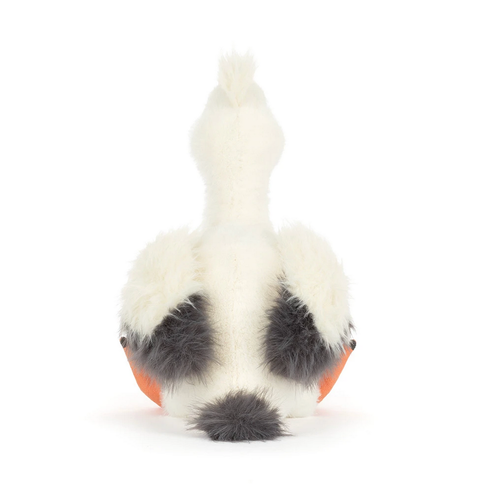White and black paw-shaped toy on a white background