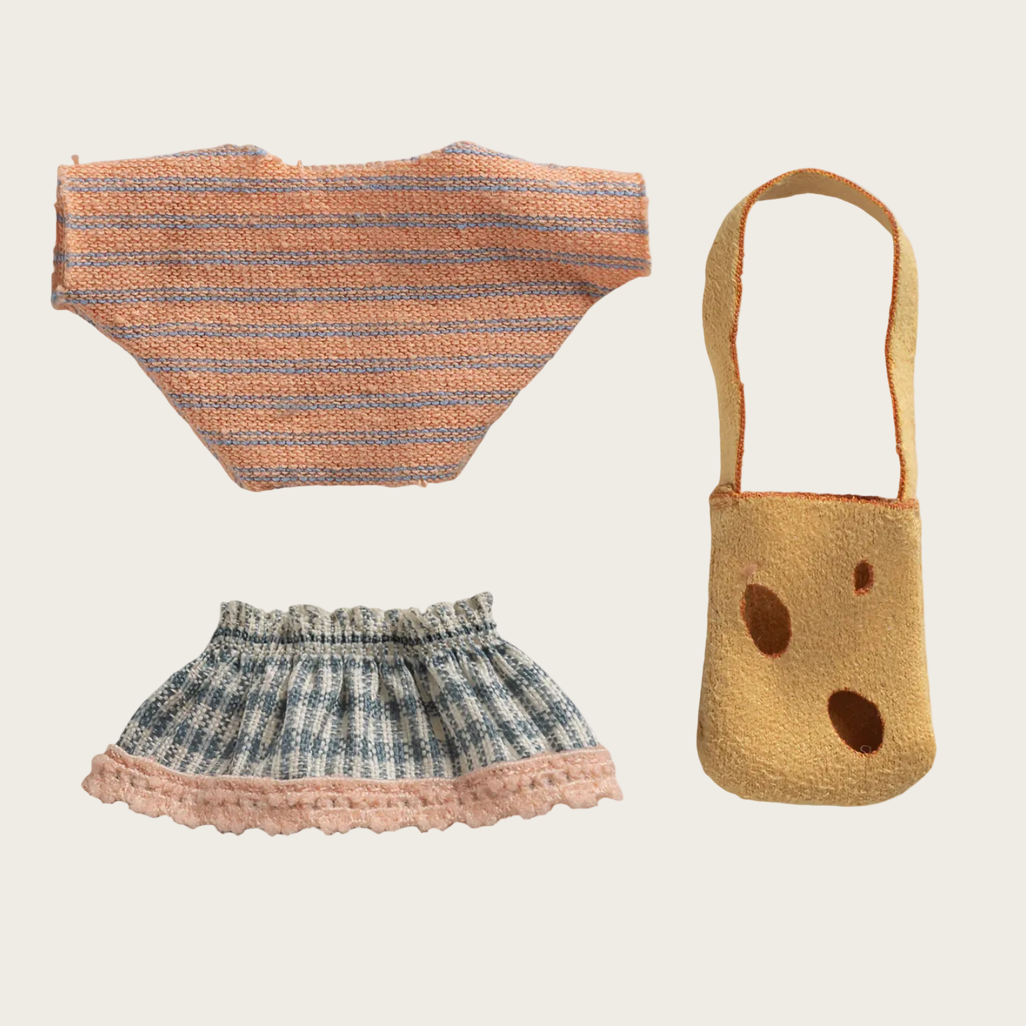 Woven top, skirt, and bag displayed on a website with product details.