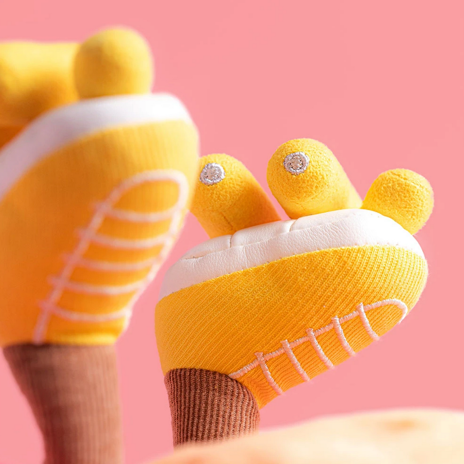Yellow roller skates with bear ears on a pink background
