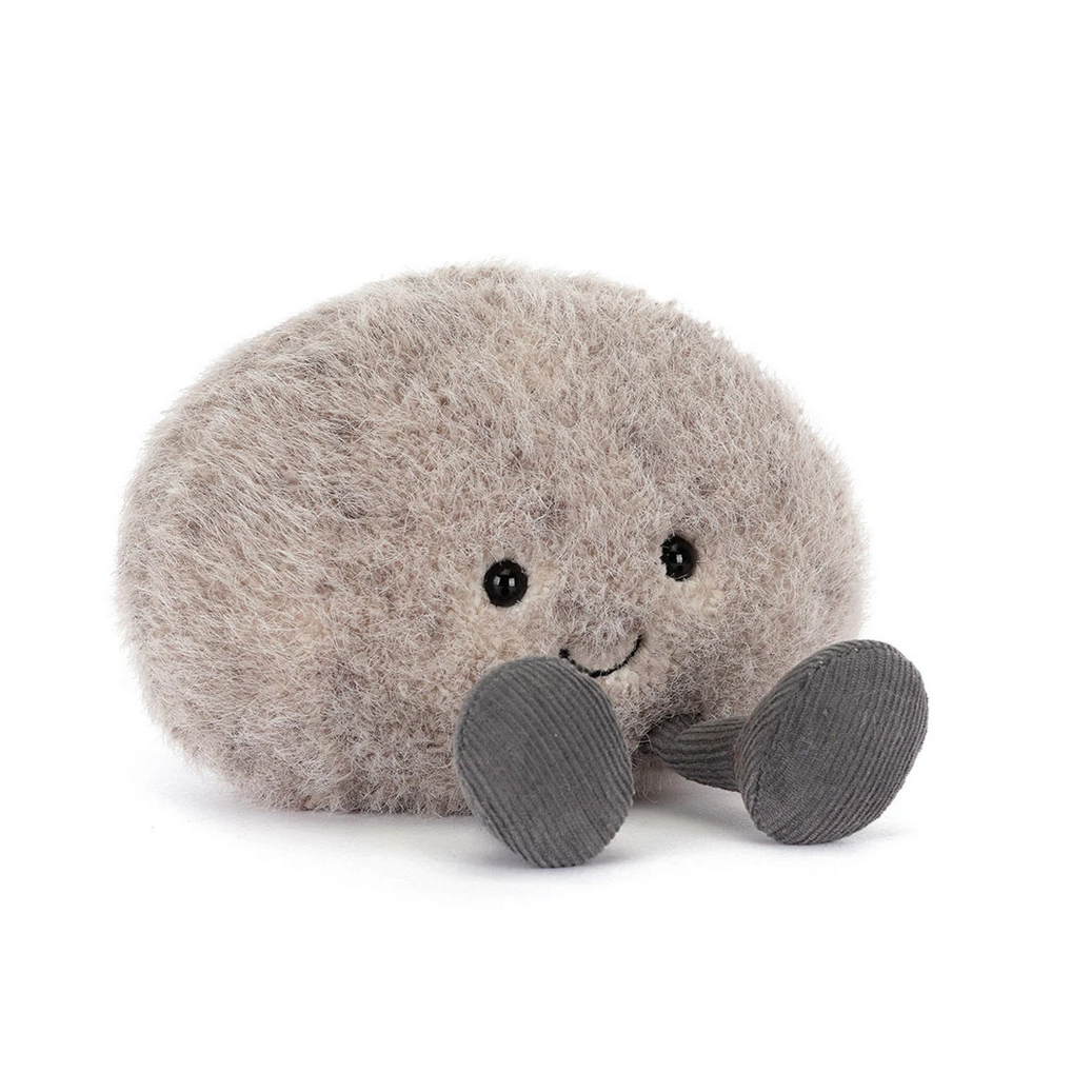 Gray plush toy with a smiling face on a white background