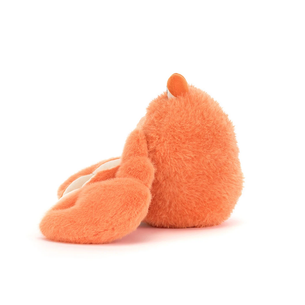 Orange plush crab toy on a white background 