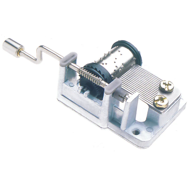 Mechanical music box component on a white background