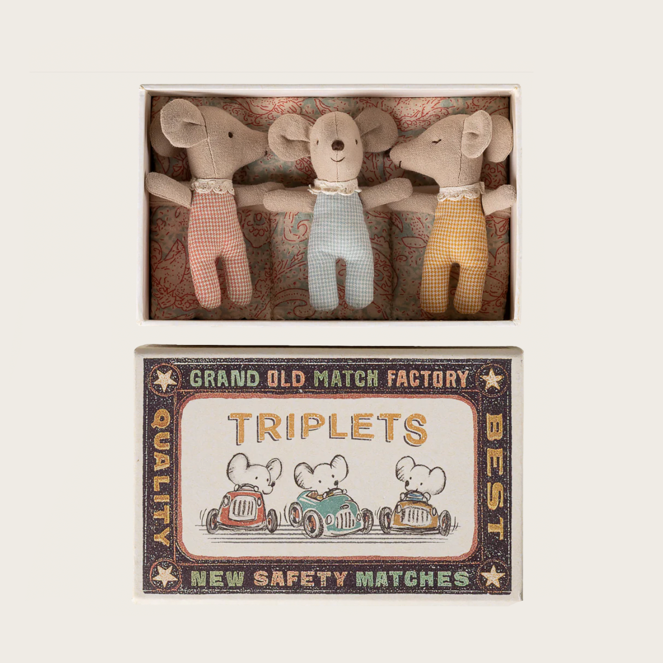 Three stuffed mouse toys in a decorative box with a vintage matchbox design.