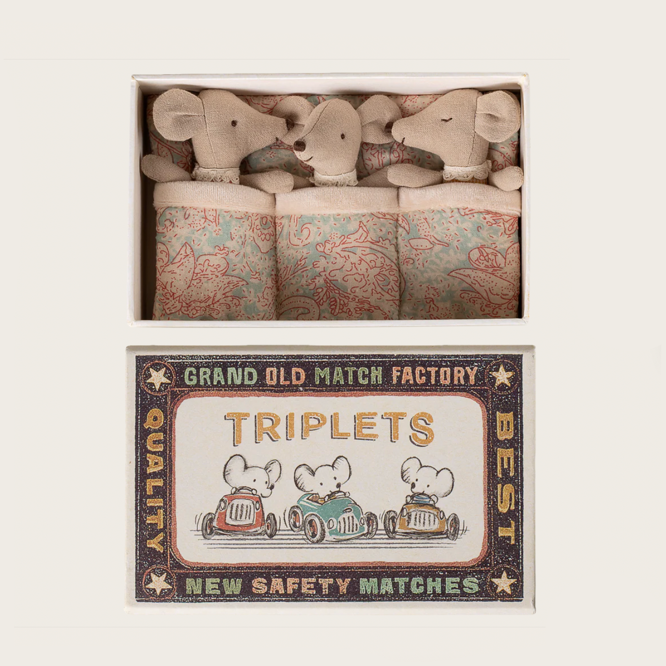 Matchbox with teddy bear design and vintage matchbox packaging on a light gray background