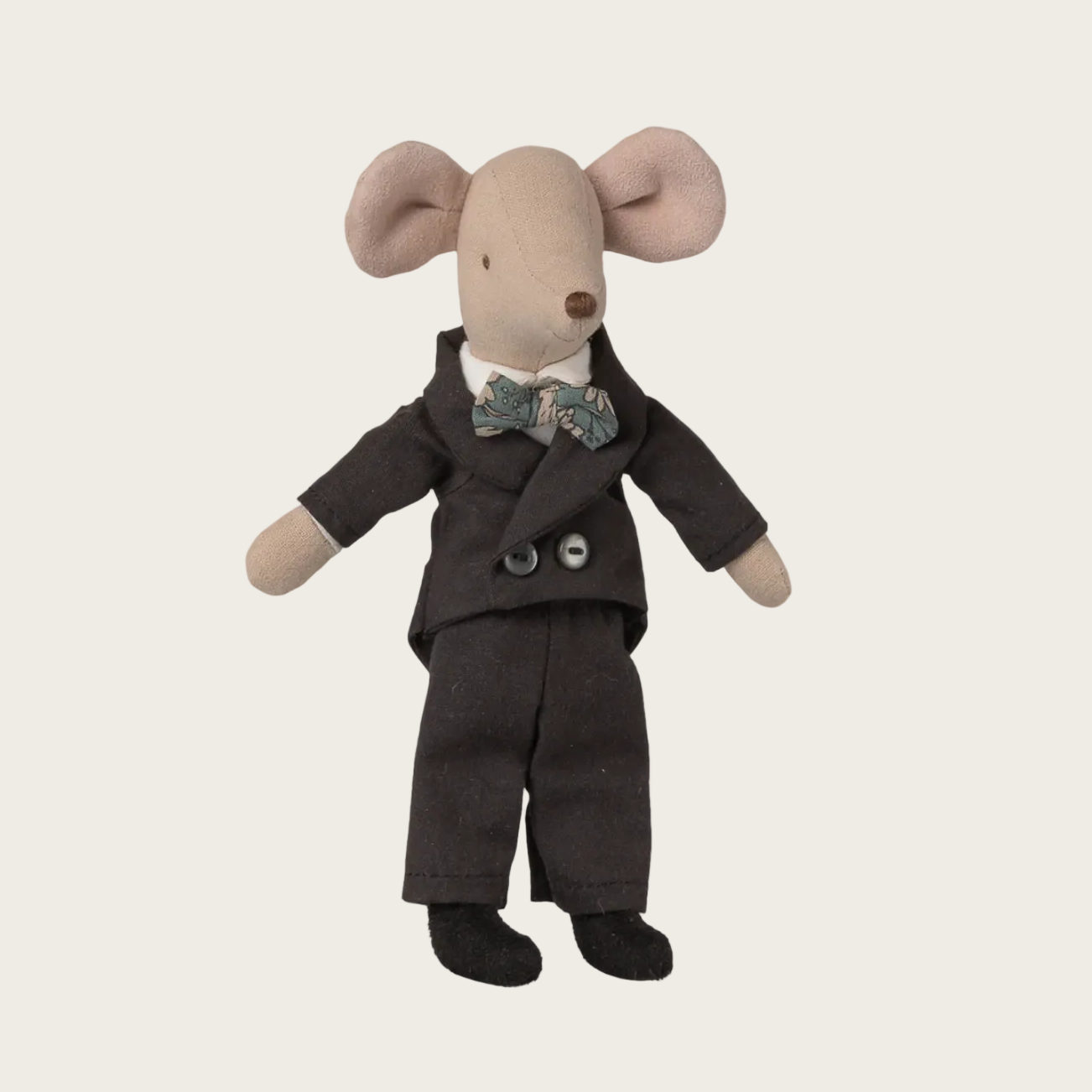 Stuffed toy mouse in a suit with a bow tie on a website page