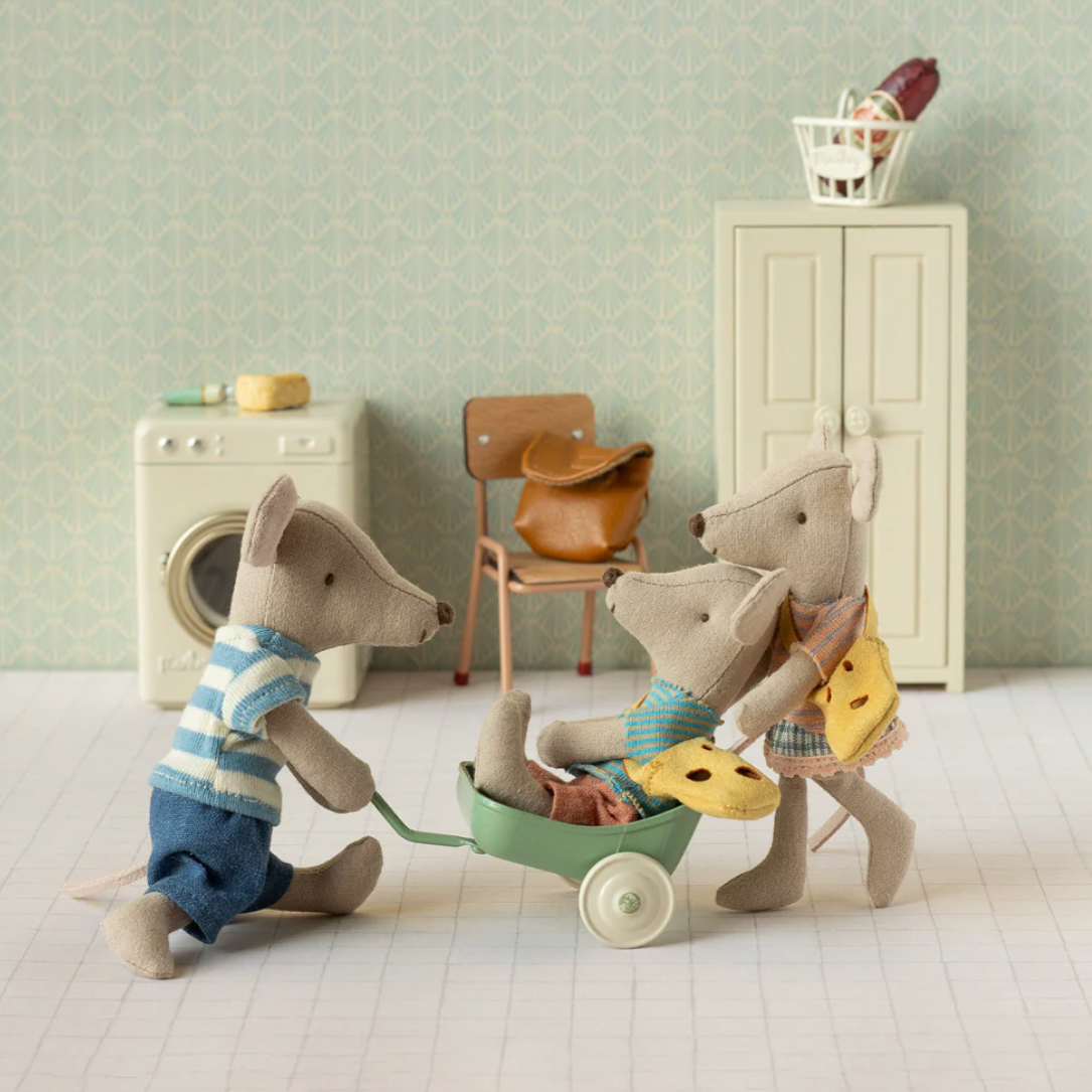 Toy mice in a room with furniture and decor