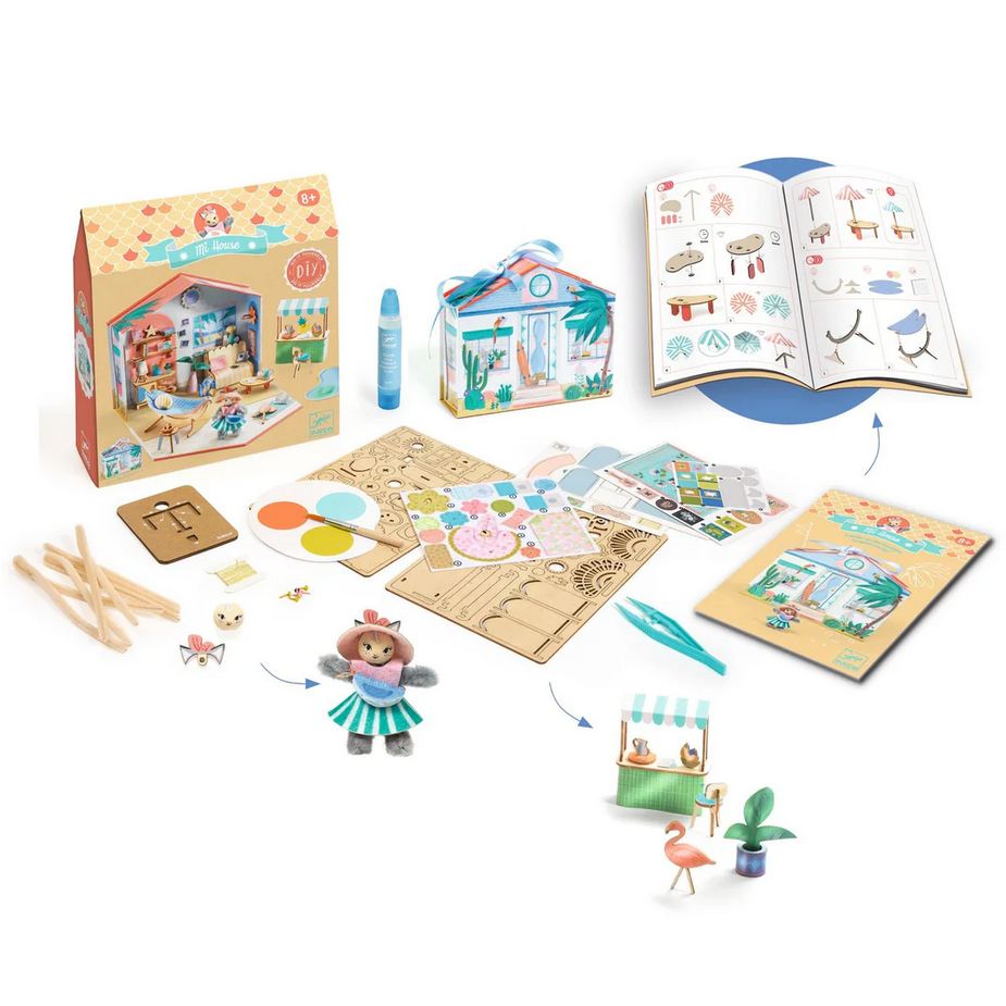 Children's playset with wooden pieces, toys, and a book on a white background