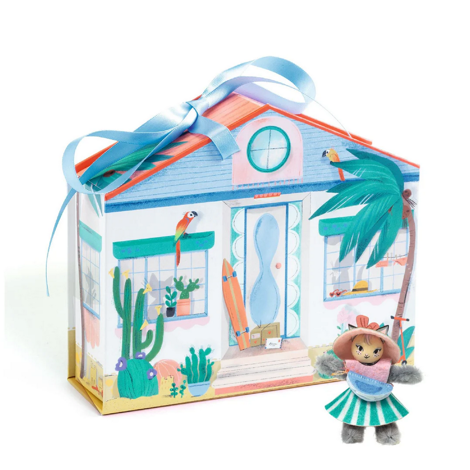 Toy house with a decorative ribbon, a doll, and palm tree on a white background