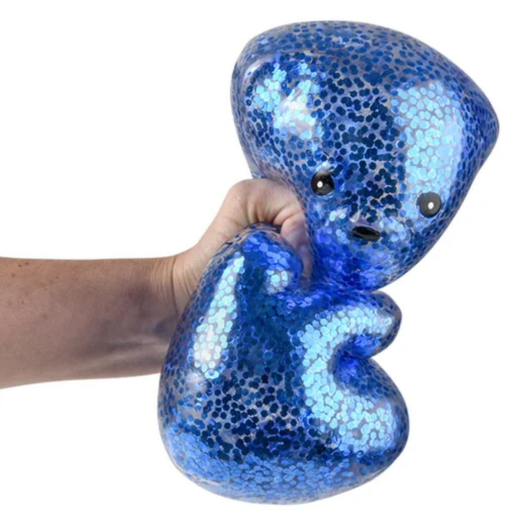 Blue sequin toy held by a hand
