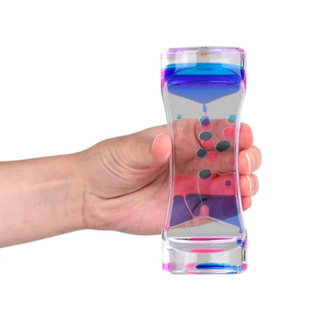 Hand holding a colorful hourglass 