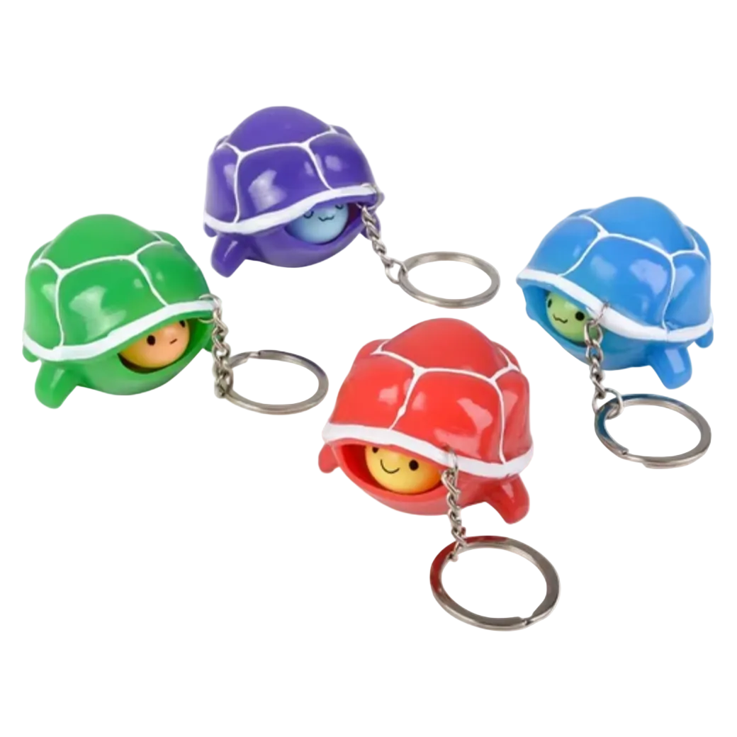 Colorful turtle-shaped keychains on a white background