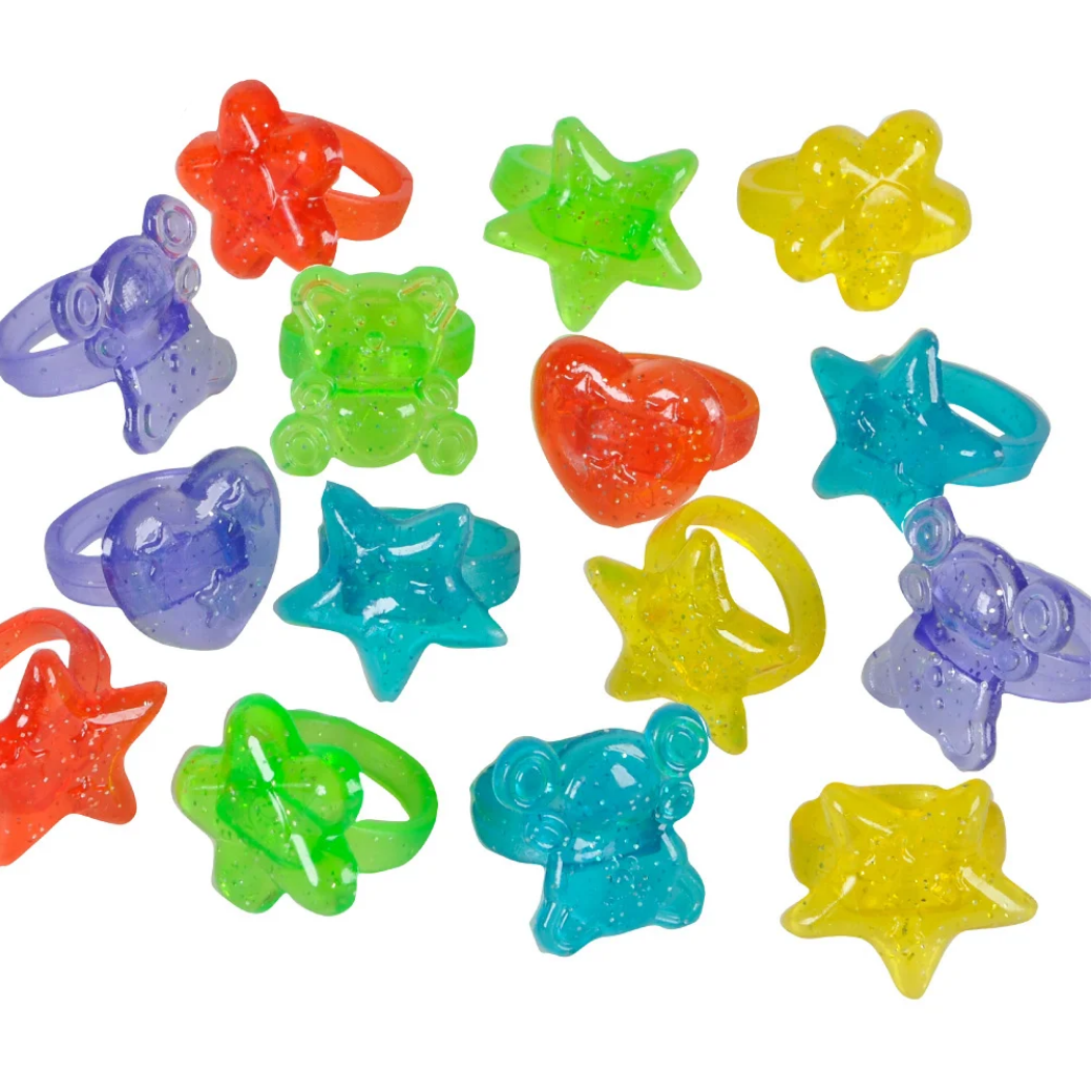 Colorful plastic rings shaped like stars and bears on a white background