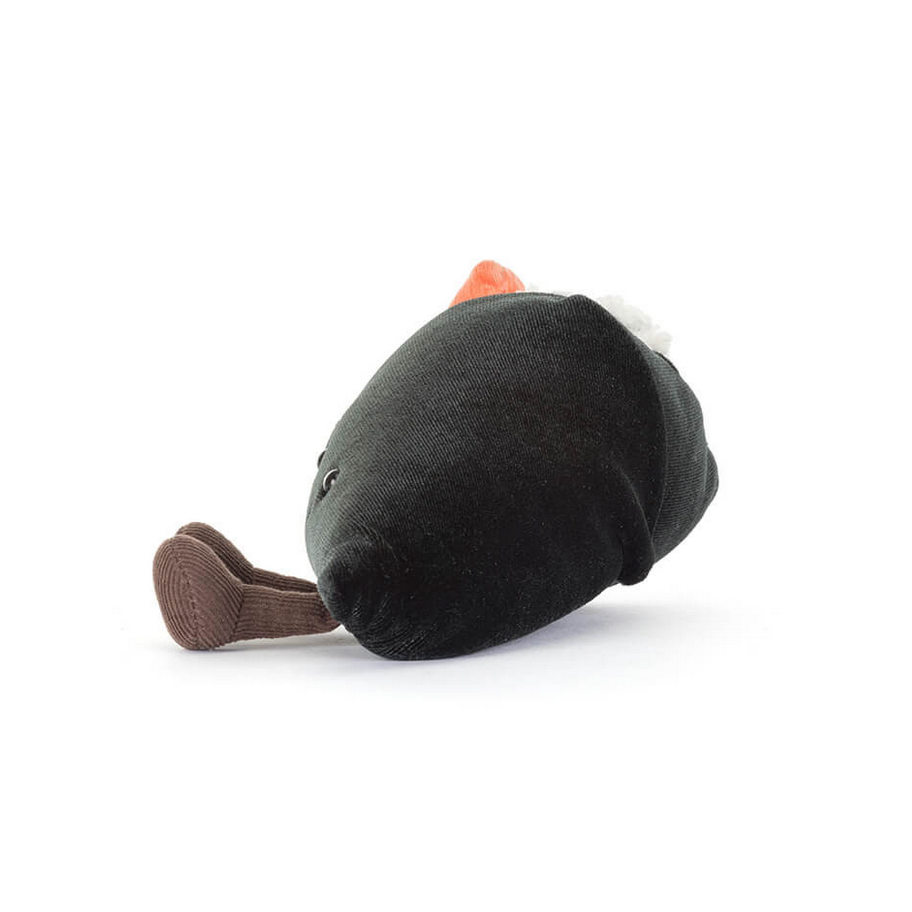 Black plush toy with brown legs on a white background