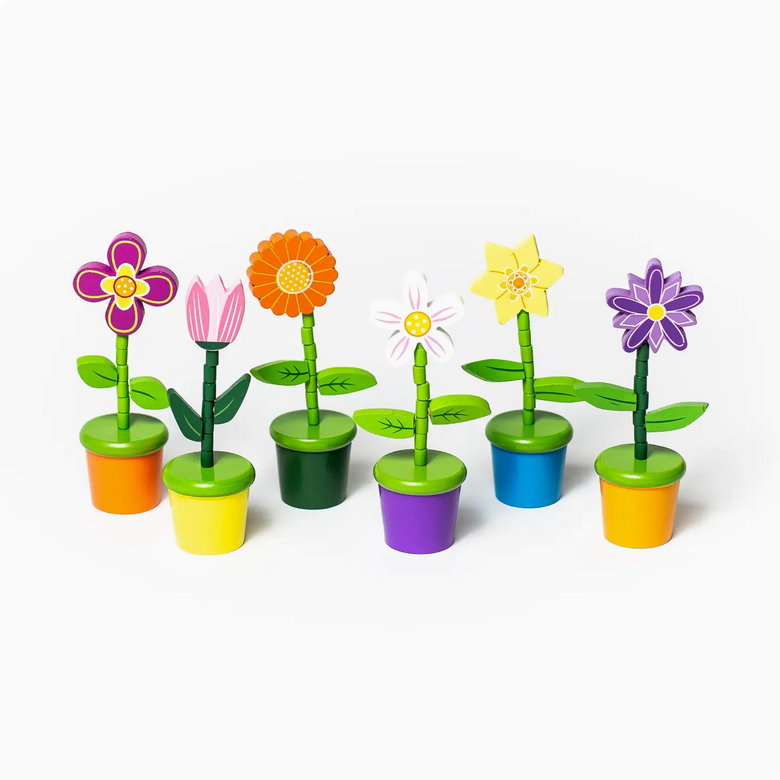 Set of colorful flower toys with pot holders on a white background