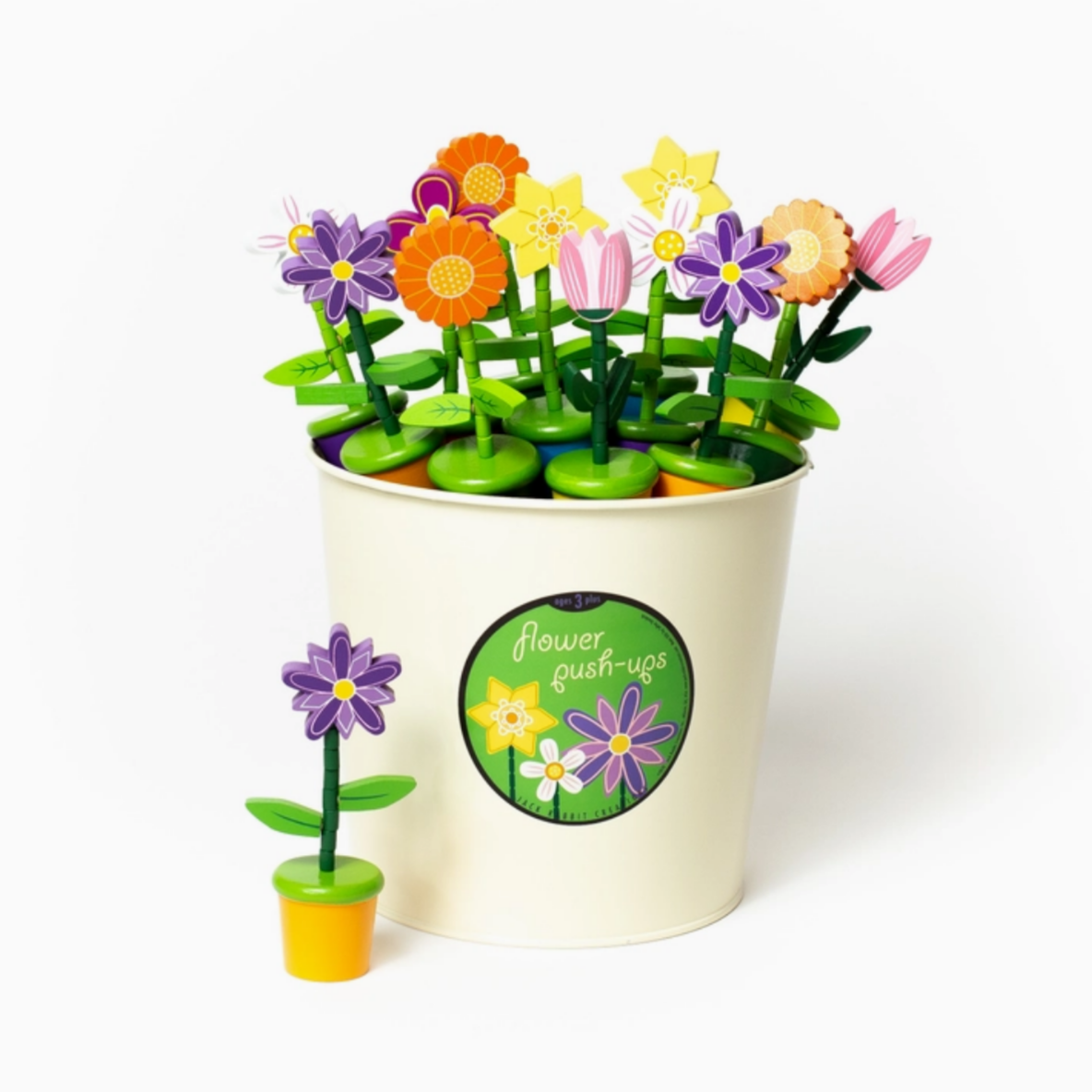 Colorful toy flower pot with small plants on a white background