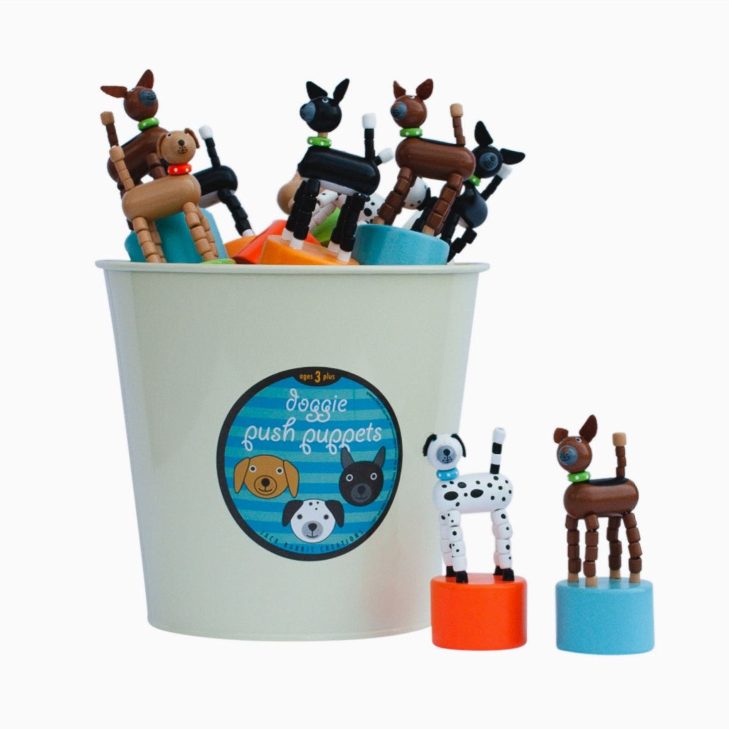 Bucket of doggie plush puppets with a label on a white background