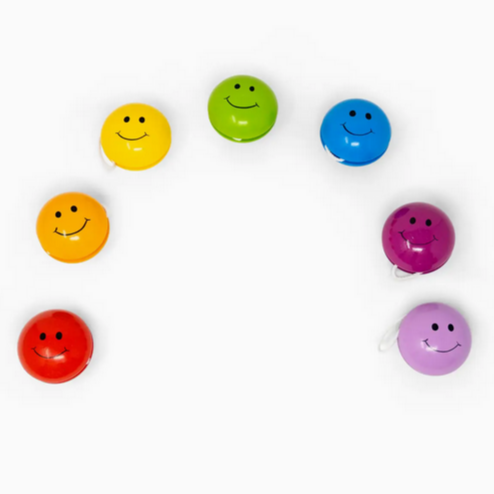 Colorful smiley face yo-yo's on a white background