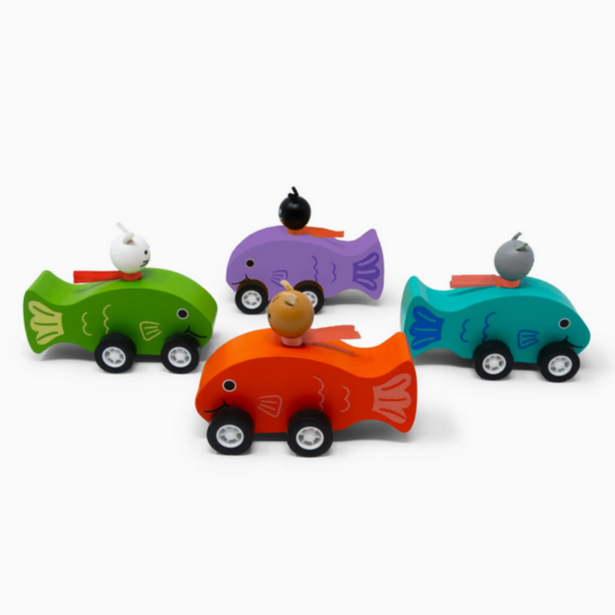 Set of colorful wooden toy cars on a white background