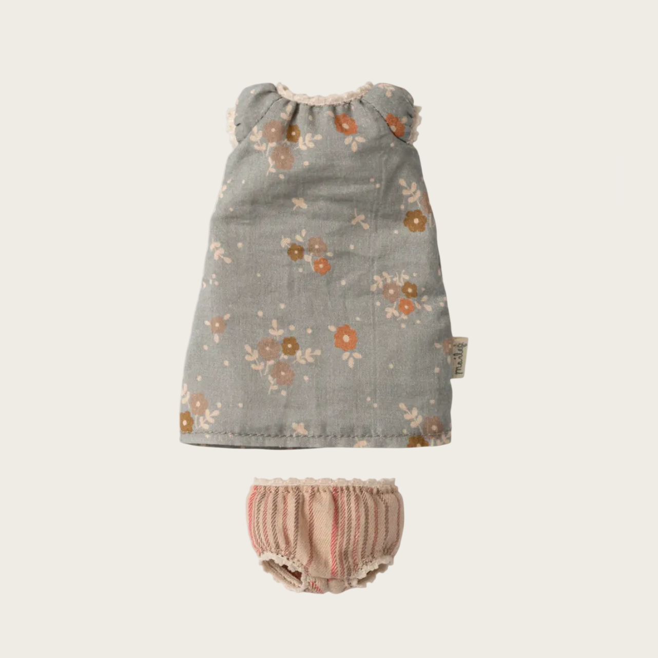Floral dress and bloomers with product details on a website interface