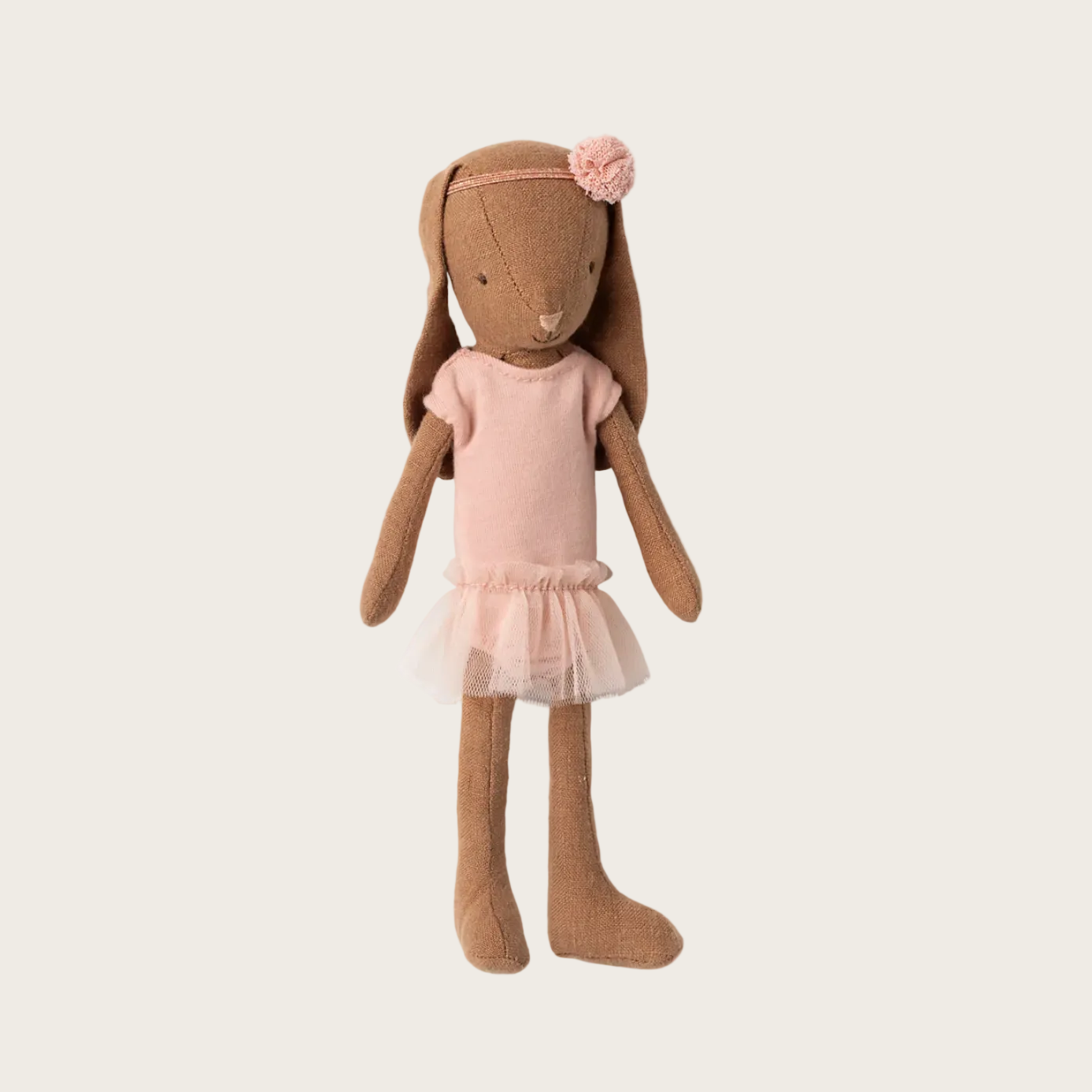 Bunny toy in a ballet outfit on a white background