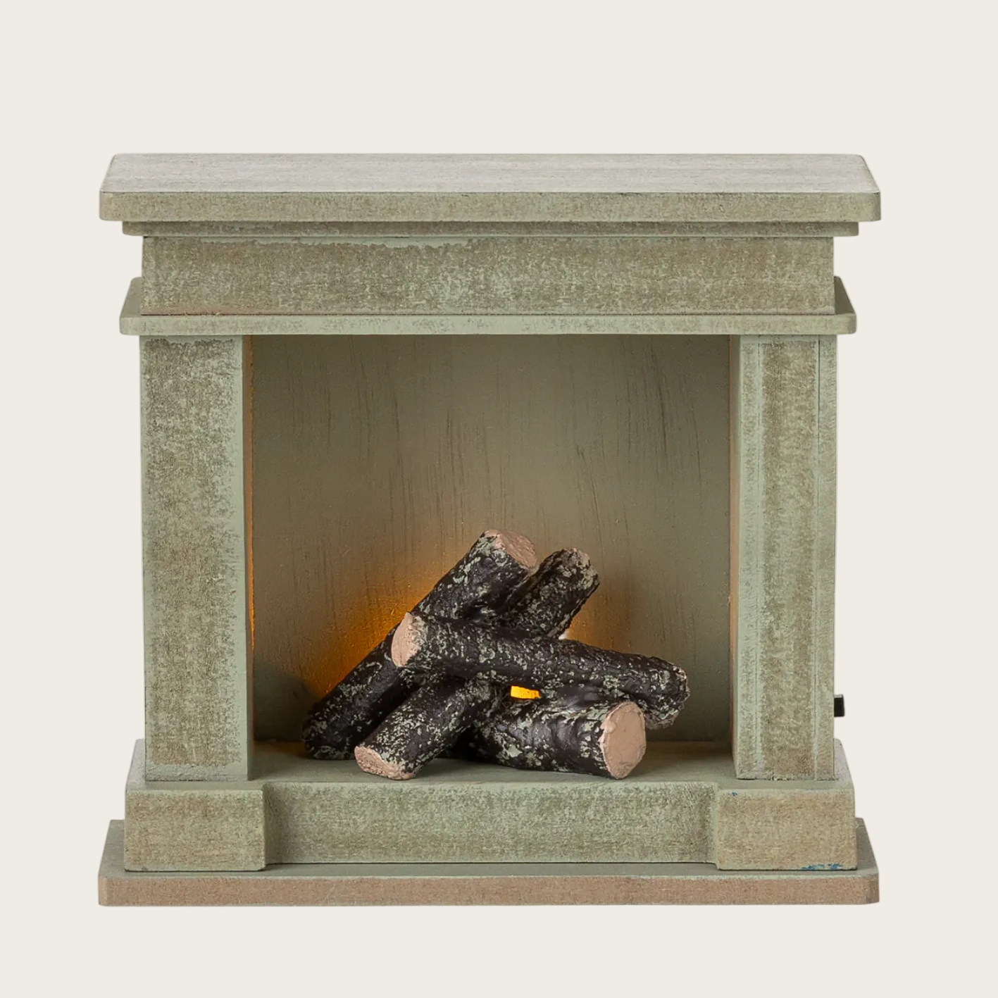 Miniature fireplace with logs 