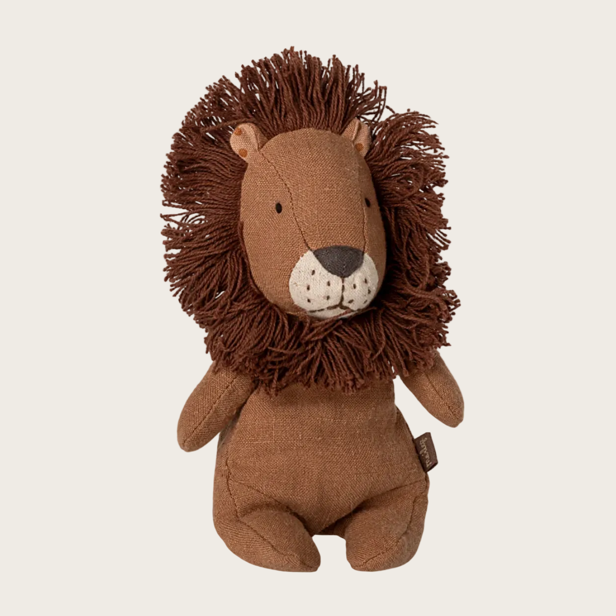 Brown lion plush toy on a white background
