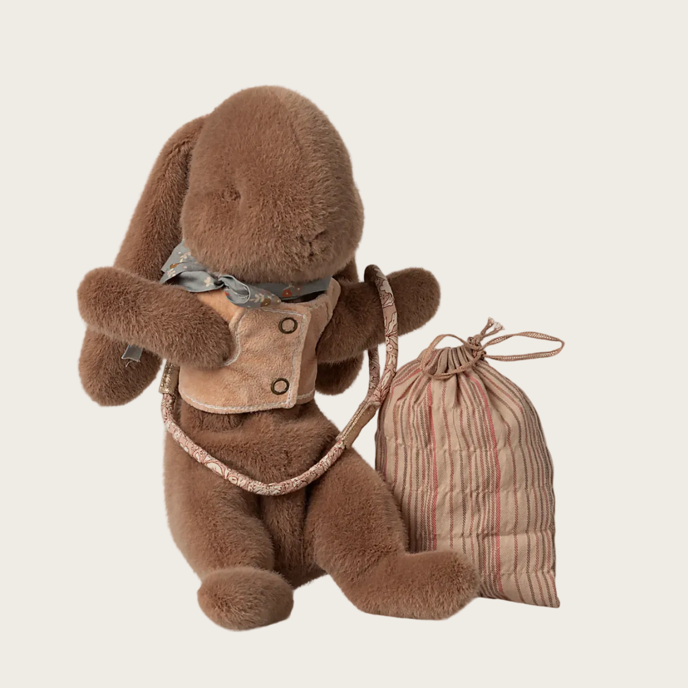 Stuffed bunny toy with a drawstring bag and harness