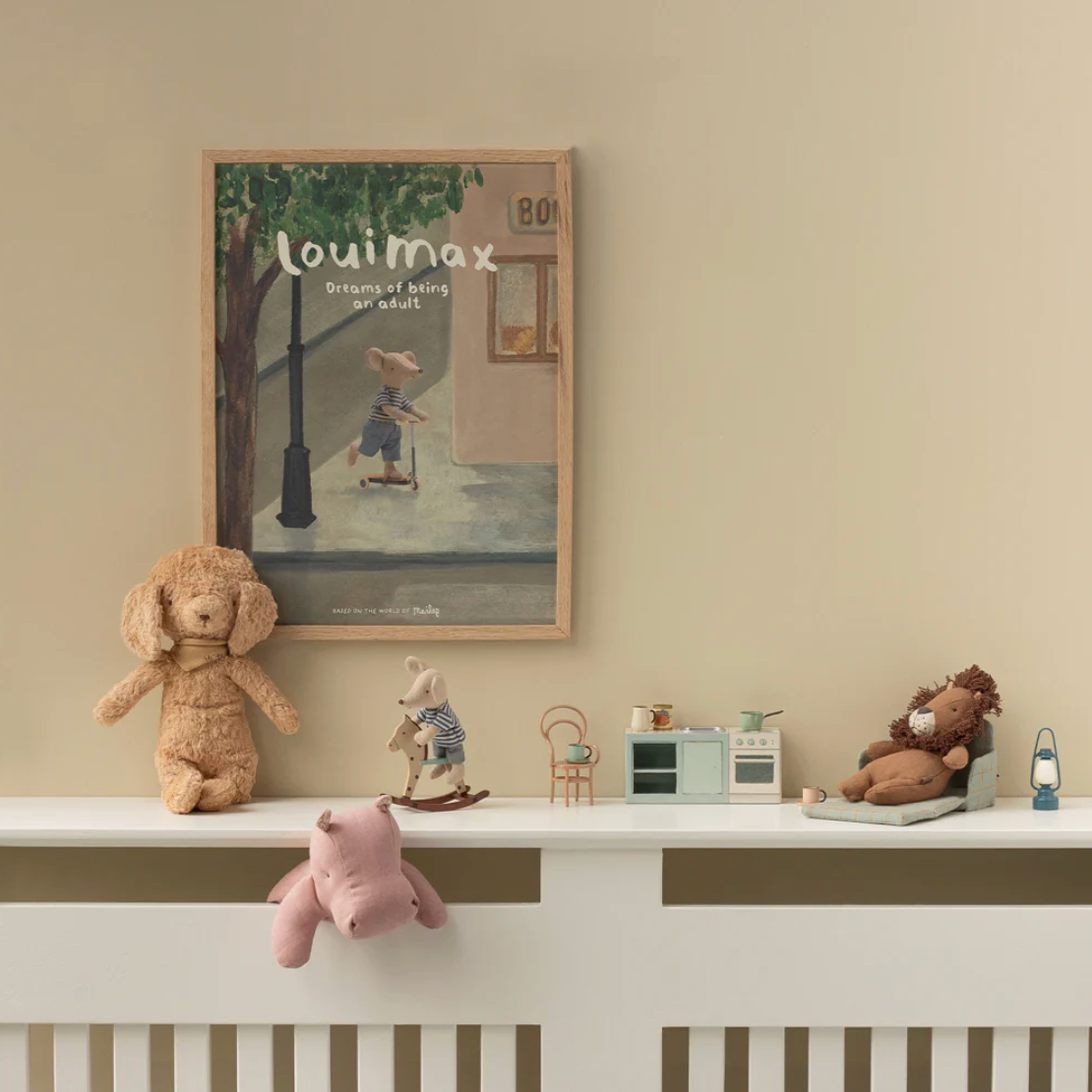 Children's room with toys on a shelf and framed picture on the wall.