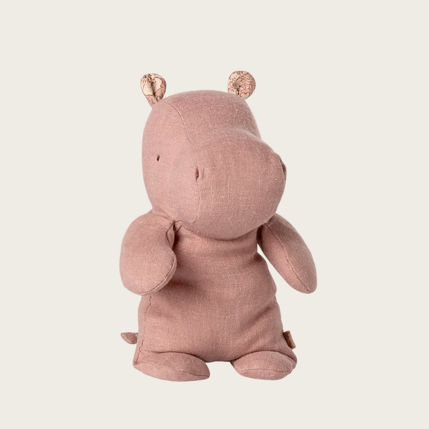 Pink hippo toy on a white background